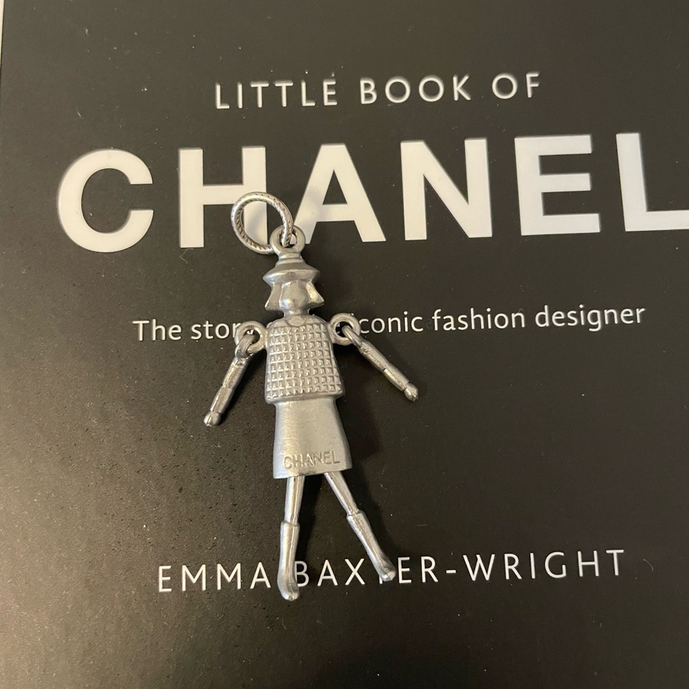 Chanel zipper pull Doll Pendant. Has moving arms and legs. Authentic